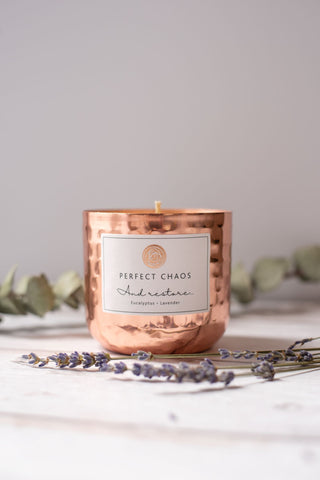 Copper dimpled candle jar with hammered metal finish scented with eucalyptus and lavender essential oils for and restore