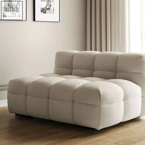 Beige plush two seater sofa with soft boucle fabric and cube shaped modular design perfect for lazy seating
