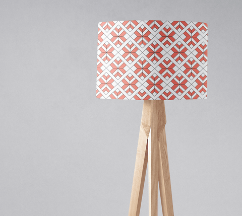 Coral and white geometric design lampshade on a light wooden tripod base perfect for a table lamp or ceiling light