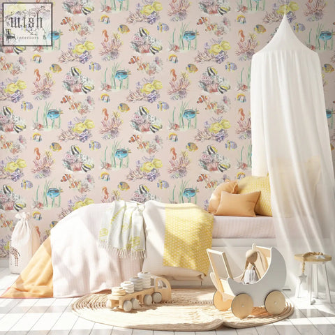 White canopy bed frame with wooden wheels and soft fabric draping next to coral reef watercolour wallpaper