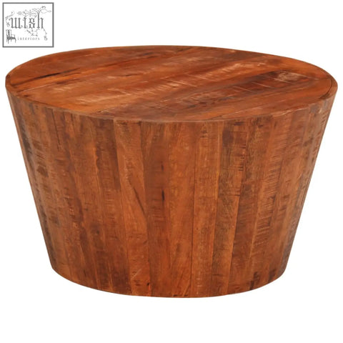 Rustic round coffee table made from solid mango wood with a warm natural finish and visible grain patterns