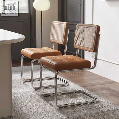 Brown leather tufted seat and cane back cornelia dining chair with chrome cantilever frame for stylish dining