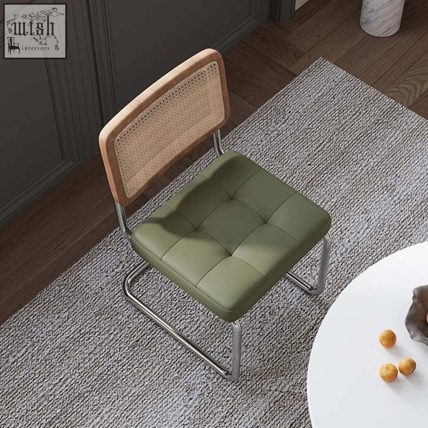 Olive green tufted leather seat with woven cane backrest and chrome frame on cornelia dining chair rattan
