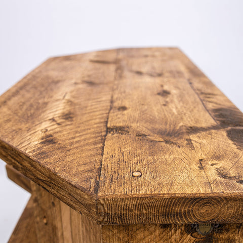 Reclaimed wood hexagonal stool with rustic finish and black steel legs perfect for corner tv units or plant stand