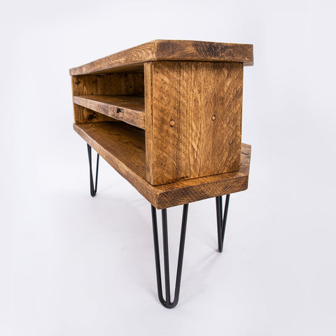 Rustic wooden corner tv unit with two open shelves and black steel hairpin legs perfect as a plant stand