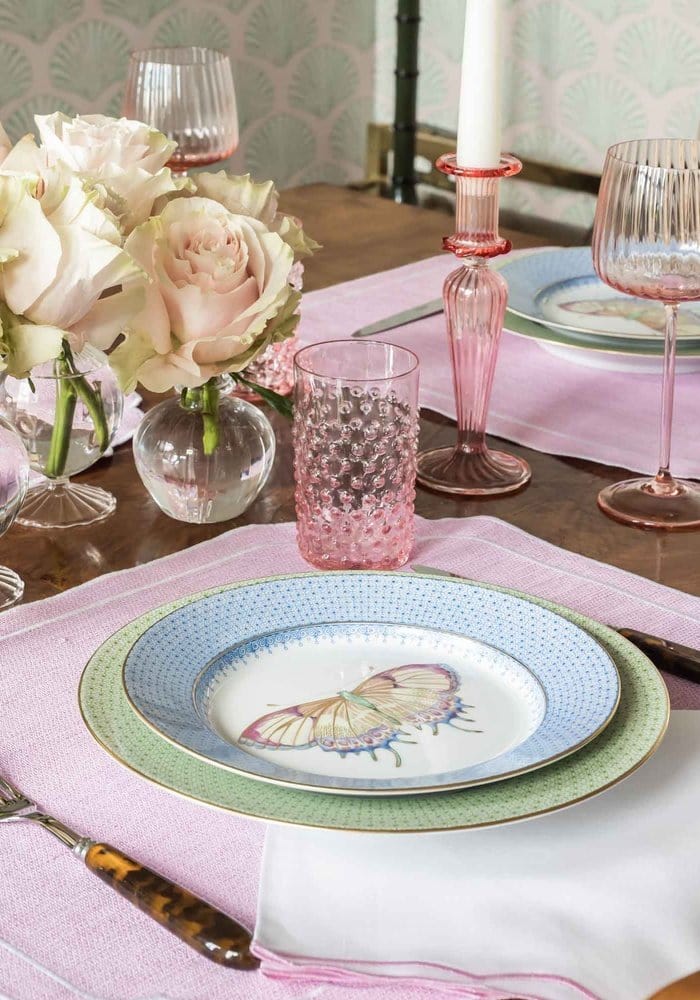 A delicate cornflower blue lace plate set of 4 featuring a butterfly design with blue and mint green rings and dots
