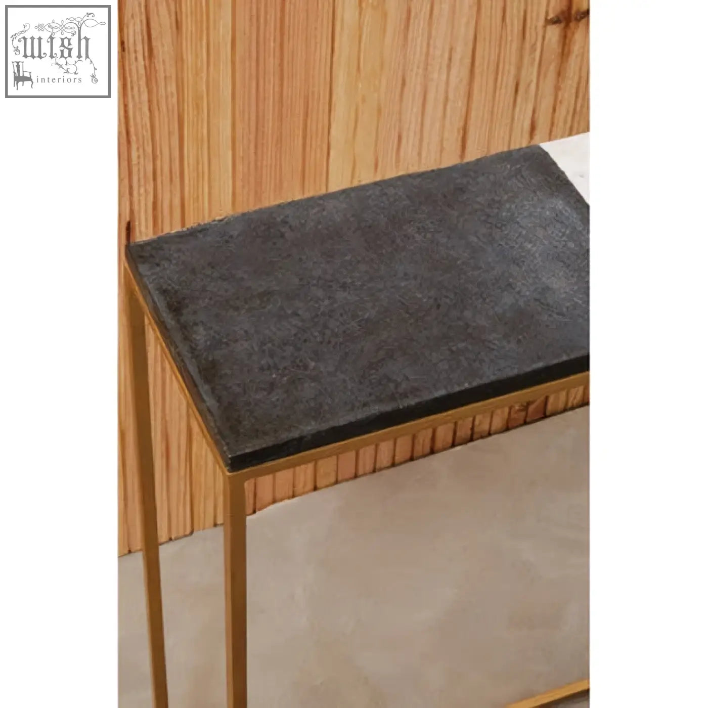 Dark gray stone top marble console table with slender gold metal legs from corra marble console collection