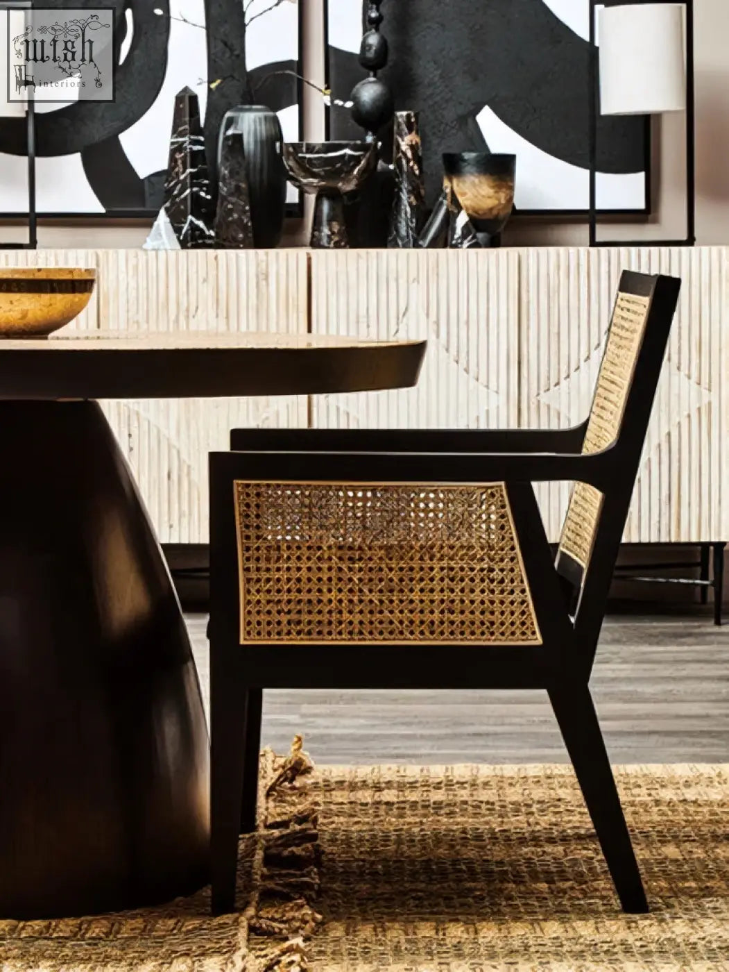 Black framed corso rattan chair with woven cane seat and back perfect for stylish indoor seating