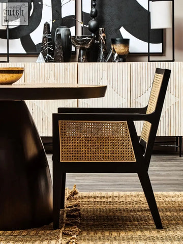 Black framed corso rattan chair with woven cane seat and back perfect for stylish indoor seating
