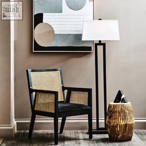 Black framed corso rattan chair with woven cane back and seat perfect for stylish indoor seating