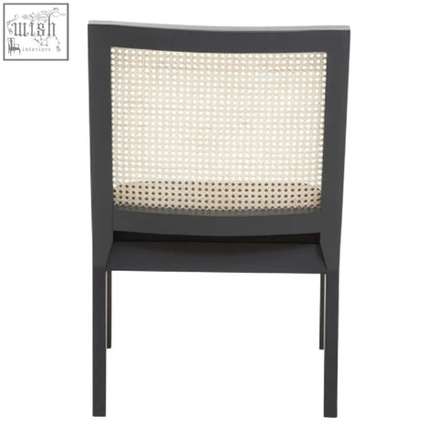 Black framed corso rattan chair with woven cane back and seat perfect for stylish indoor seating