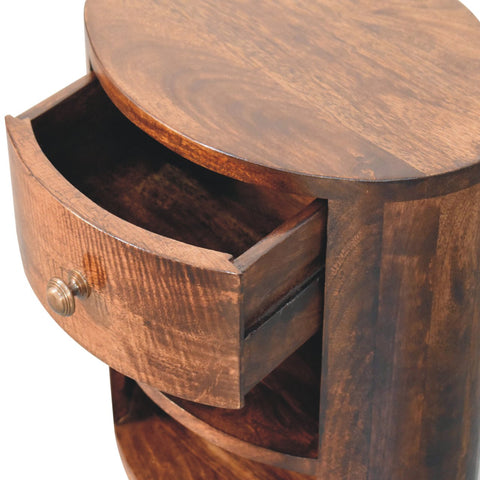 A rustic dark brown california walnut bedside table with a curved drawer and brass knob for bedroom use
