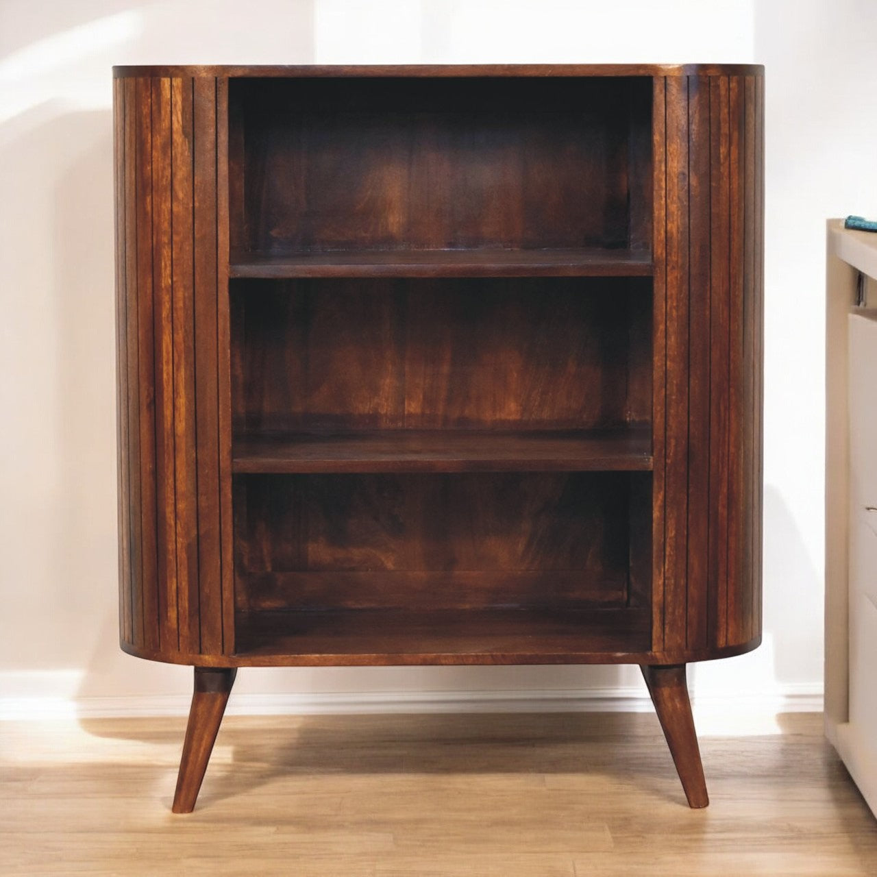 Cortez chestnut open cabinet mid-century modern curved wooden bookcase with vertical slats and tapered legs