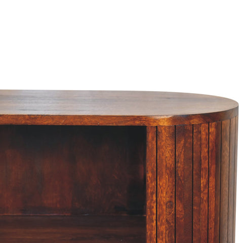 Cortez chestnut open cabinet with rich dark brown wood and curved top featuring vertical slat paneling