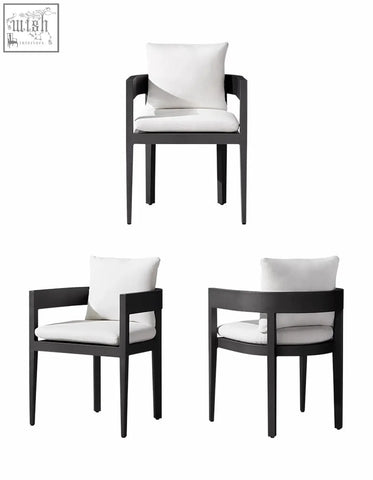 Black armchair with white cushioned seat and backrest from cortez outdoor dining table set for outdoor dining use