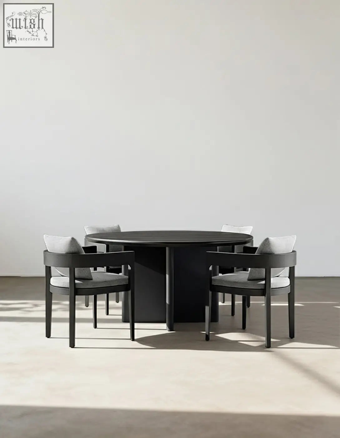 Minimalist black round dining table with sleek matte finish perfect for outdoor dining in the cortez table set