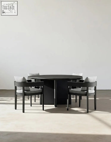 Minimalist black round dining table with sleek matte finish perfect for outdoor dining in the cortez table set