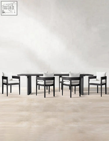 Modern black cortez outdoor dining table set with minimalist design and white cushioned chairs for outdoor dining