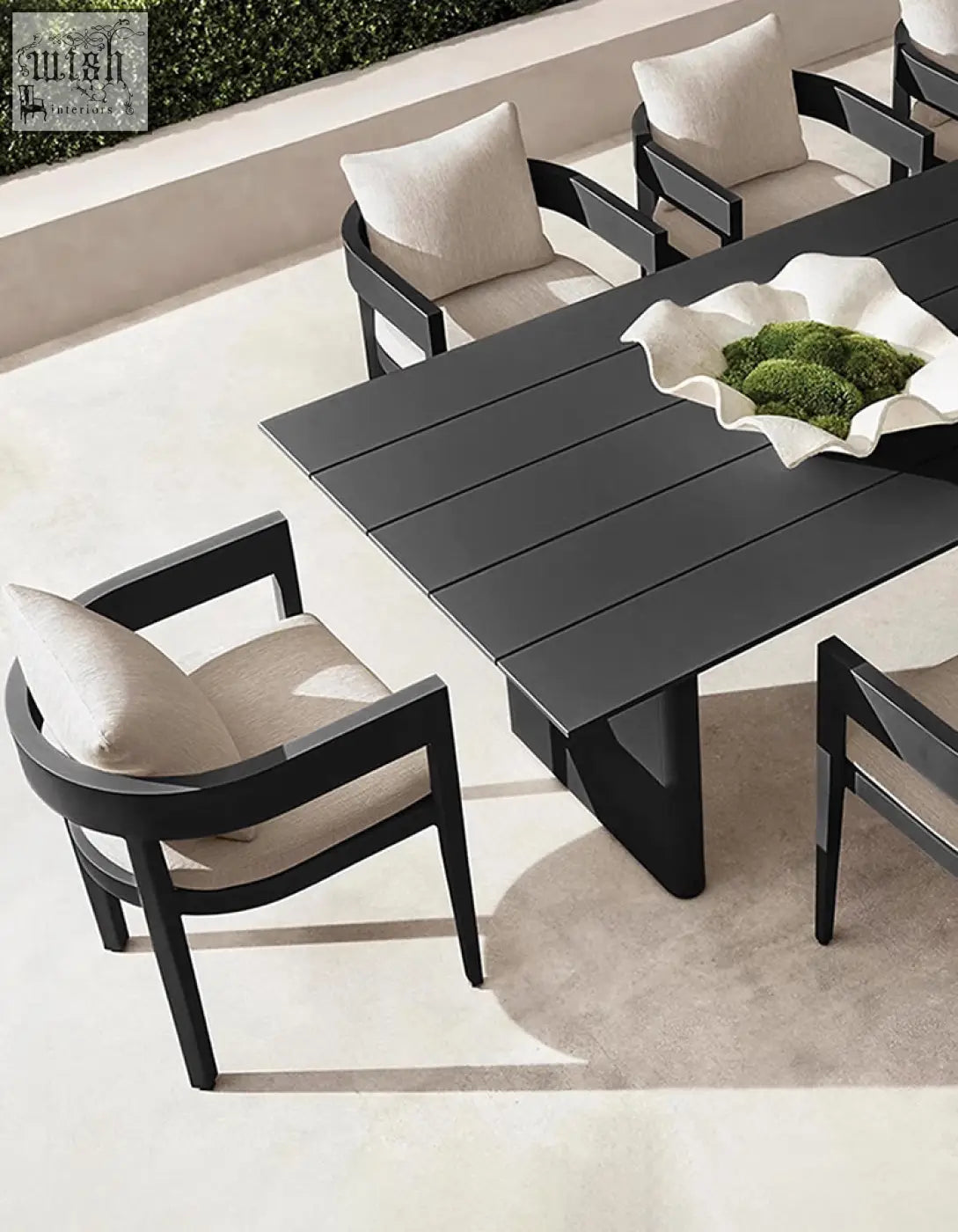 Modern black cortez outdoor dining table set with sleek minimalist design and beige cushioned chairs for outdoor dining