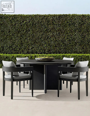 Modern black cortez outdoor dining table set with sleek design and gray upholstered cushions for outdoor dining