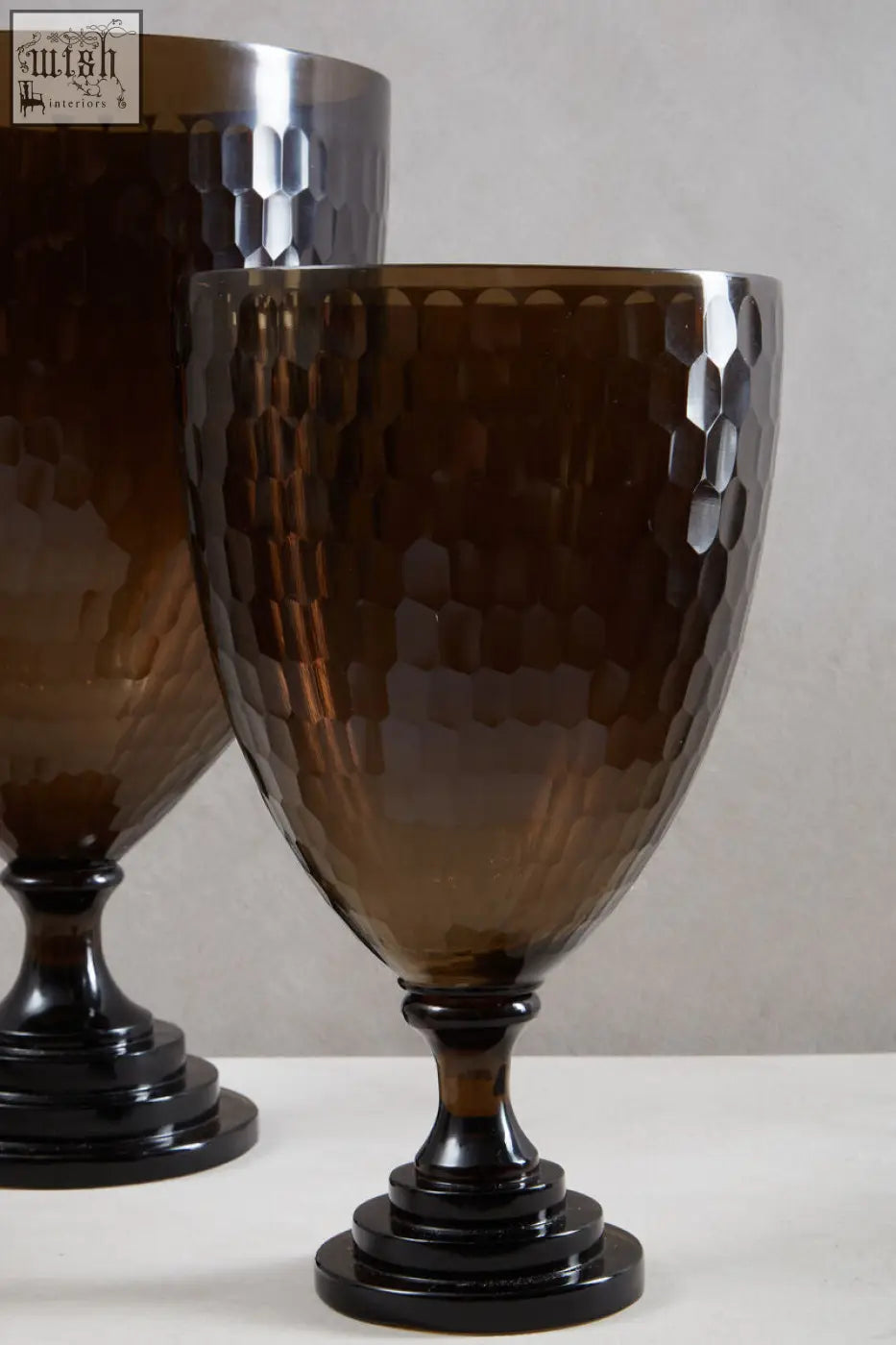 Amber-colored cortina medium honeycomb glass candle holder with hammered hexagonal texture and black base glass candle holder