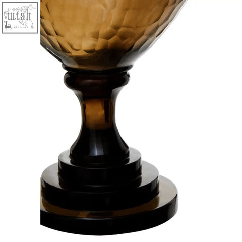 Amber-hued textured glass candle holder with dark brown stem and tiered base perfect as a glass candle holder