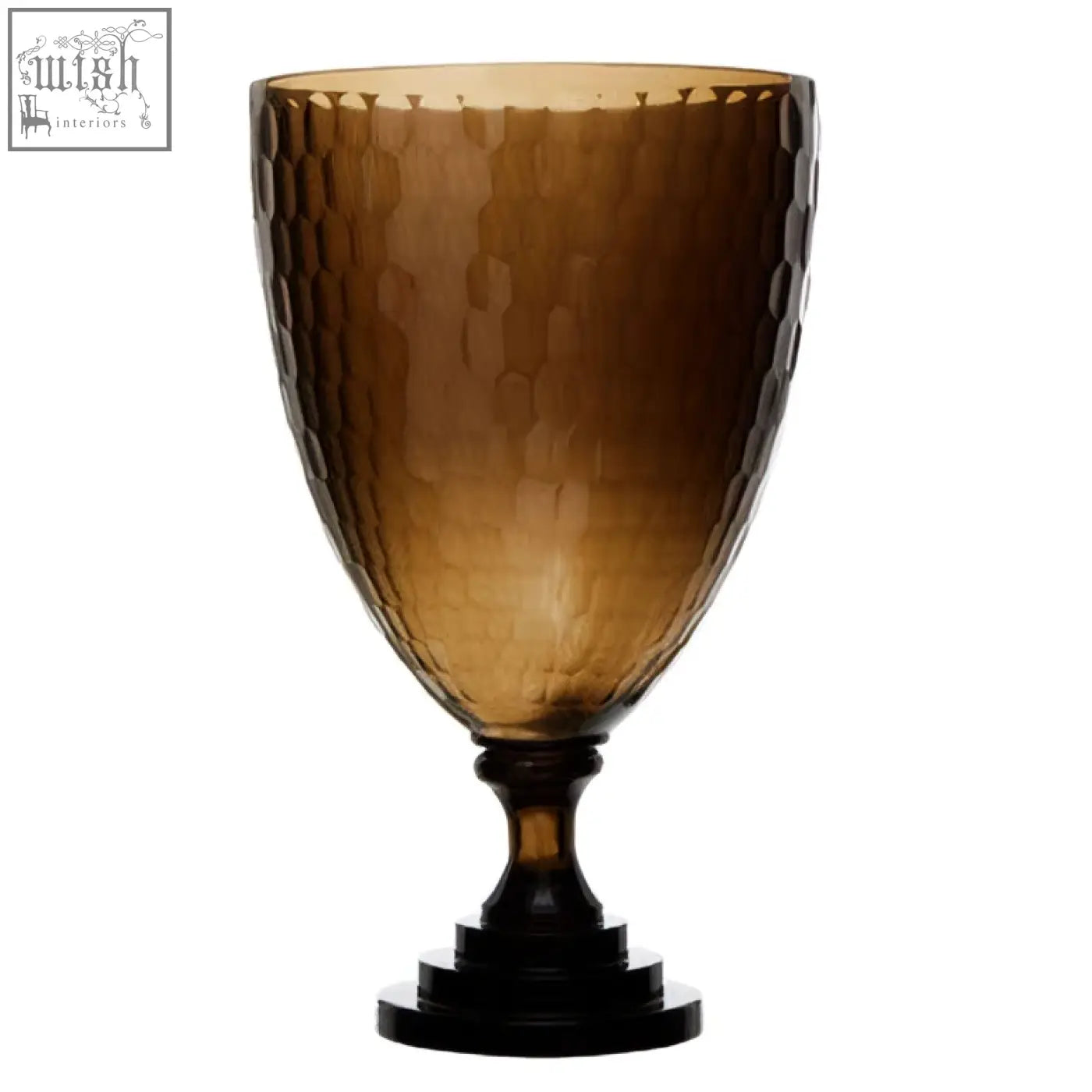 Amber-colored hammered glass candle holder with dark wooden base perfect as a stylish glass candle holder