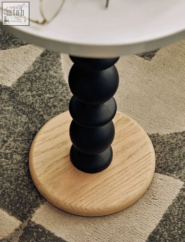 Cosmo round side table with gold tray featuring black and natural wood round segmented base with vintage charm