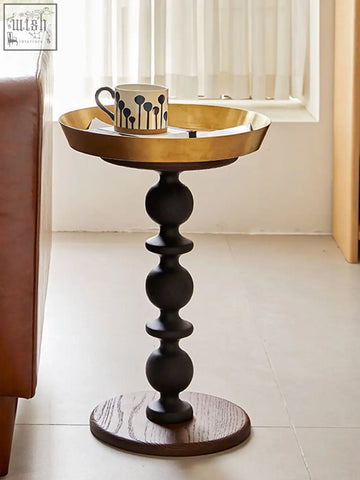 Cosmo round side table with a gold tray featuring a black ball and socket pedestal and dark wood vintage charm base