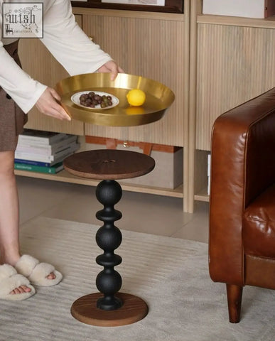 Cosmo round side table with a vintage charm gold tray featuring a smooth reflective metallic surface and raised edges