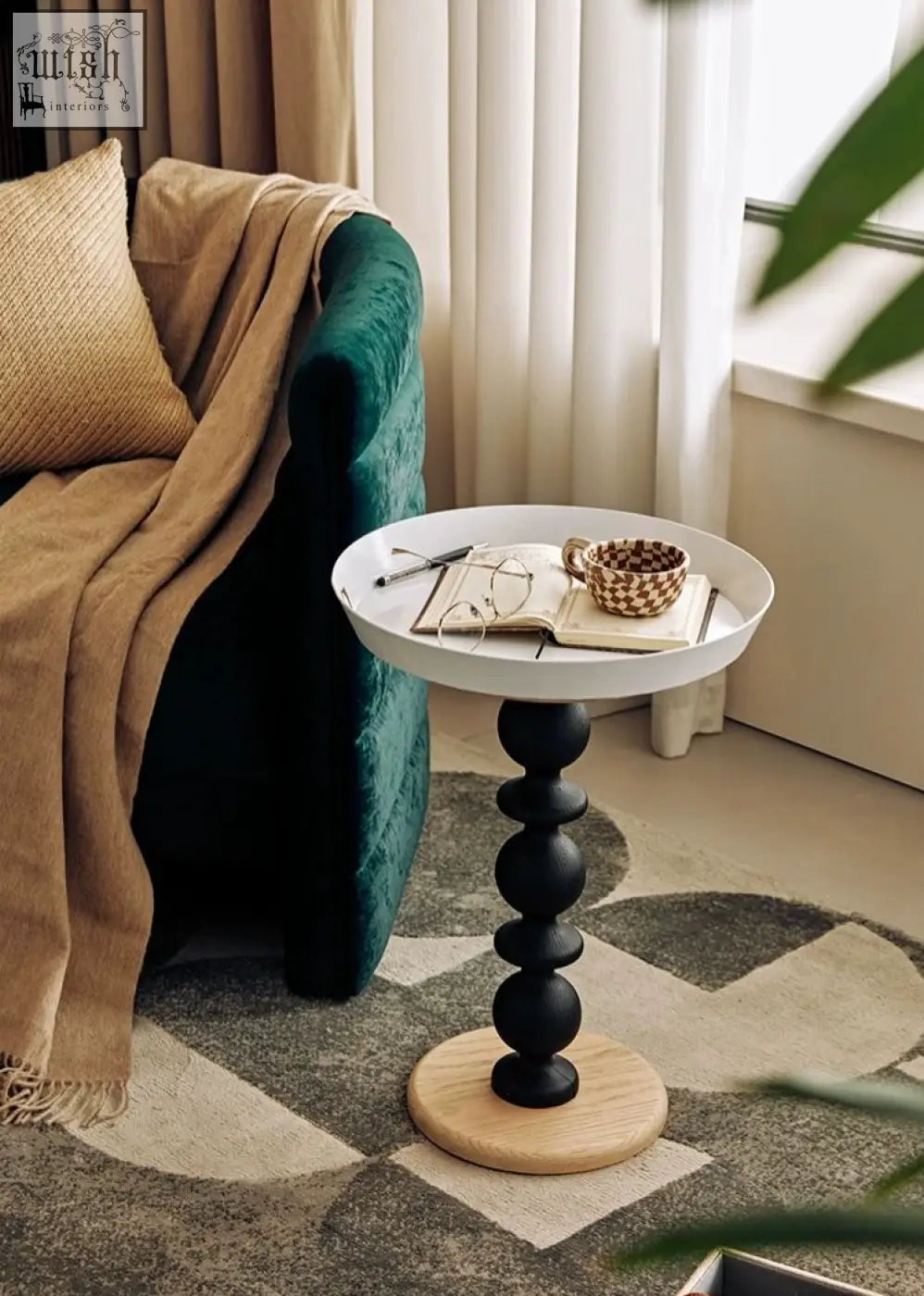 Cosmo round side table with a white round top, black beaded pedestal, light wood base, and gold tray vintage charm