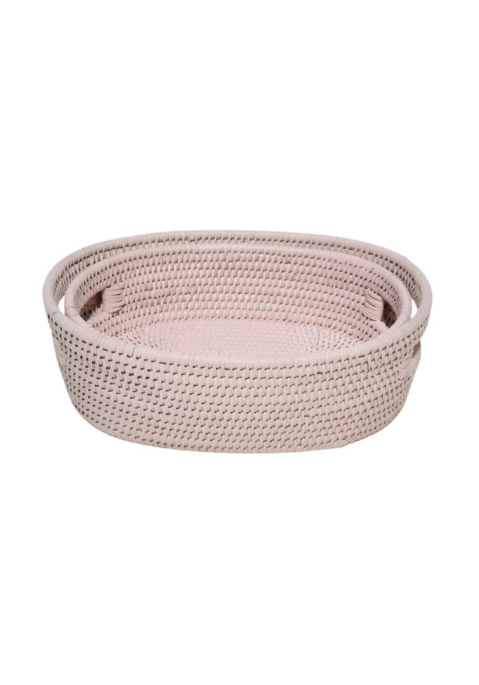 Beige woven oval rattan basket with textured interlaced pattern and handles from cotswolds pink set of 2