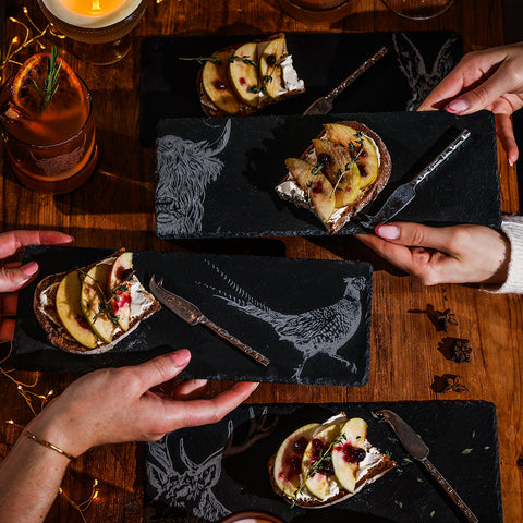 Black slate mini slate cheese boards set of 4 with engraved white highland cow pheasant and stag illustrations