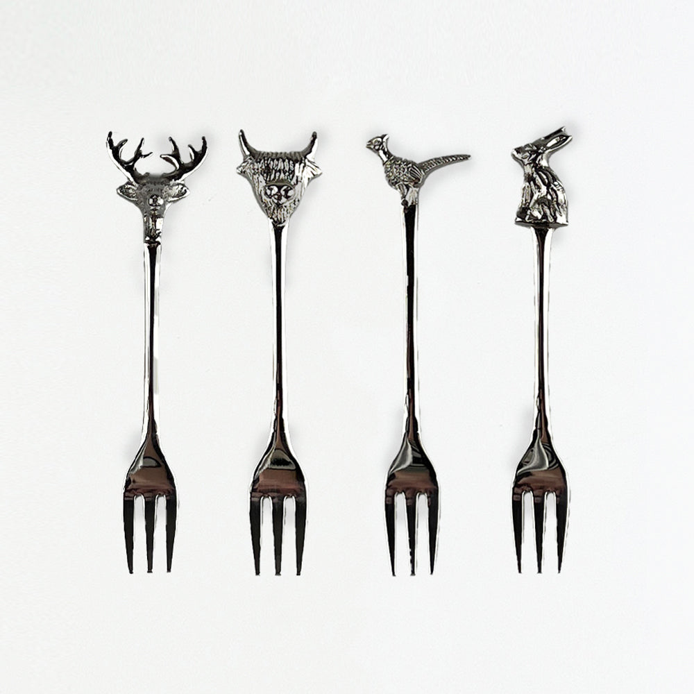 Set of 4 silver country animals pastry forks with deer highland cow pheasant and rabbit carved heads and slender handles