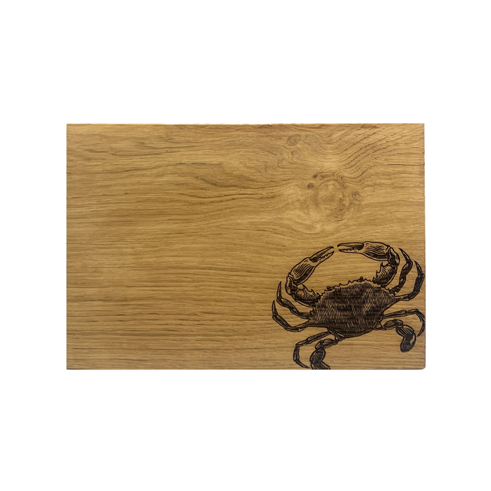 Rustic light brown oak serving board with dark engraved crab design perfect as a crab oak serving cheese board