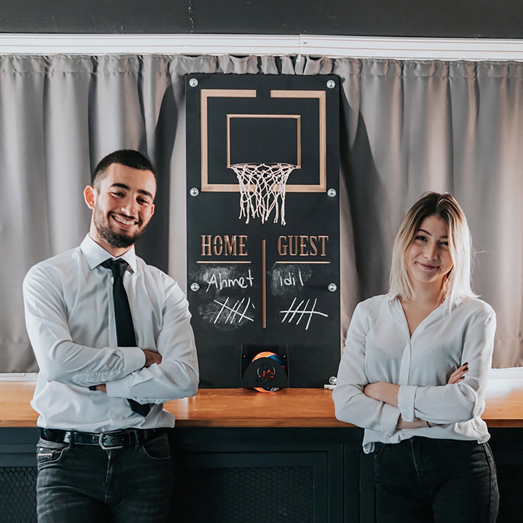 Black wall-mounted craft mega basketball wall game with gold trim white net chalk home guest target area and ball holder