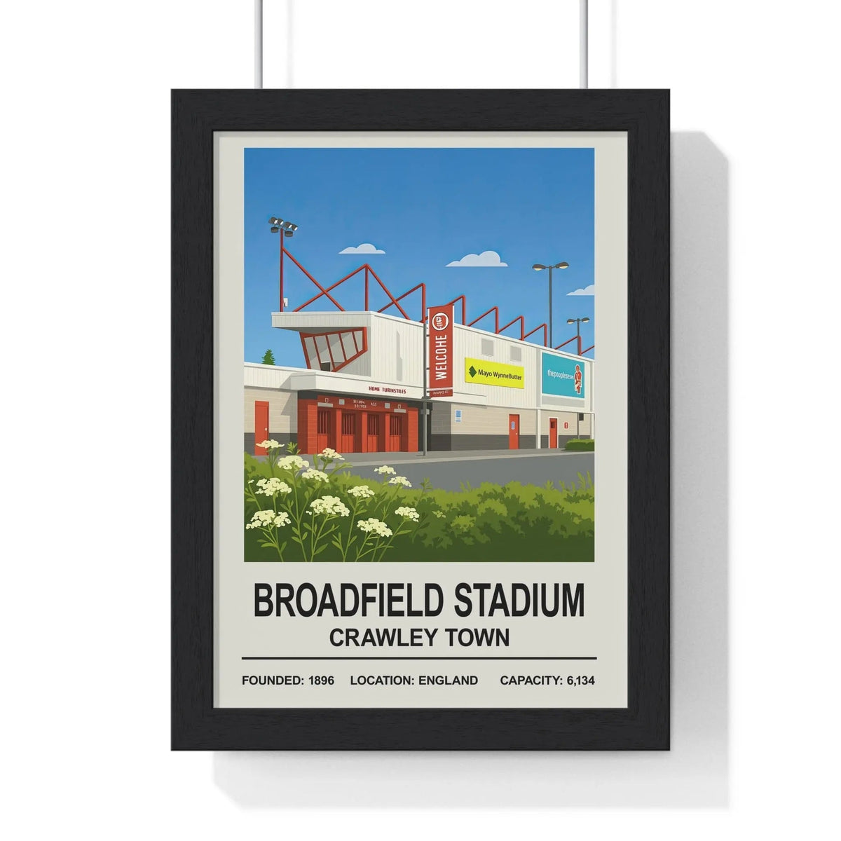 Black-framed poster featuring a stylized illustration of crawley broadfield stadium called crawley broadfield stadium print