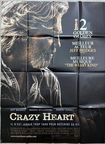 Black movie poster for crazy heart 2009 featuring close-up of jeff bridges with acoustic guitar on neck