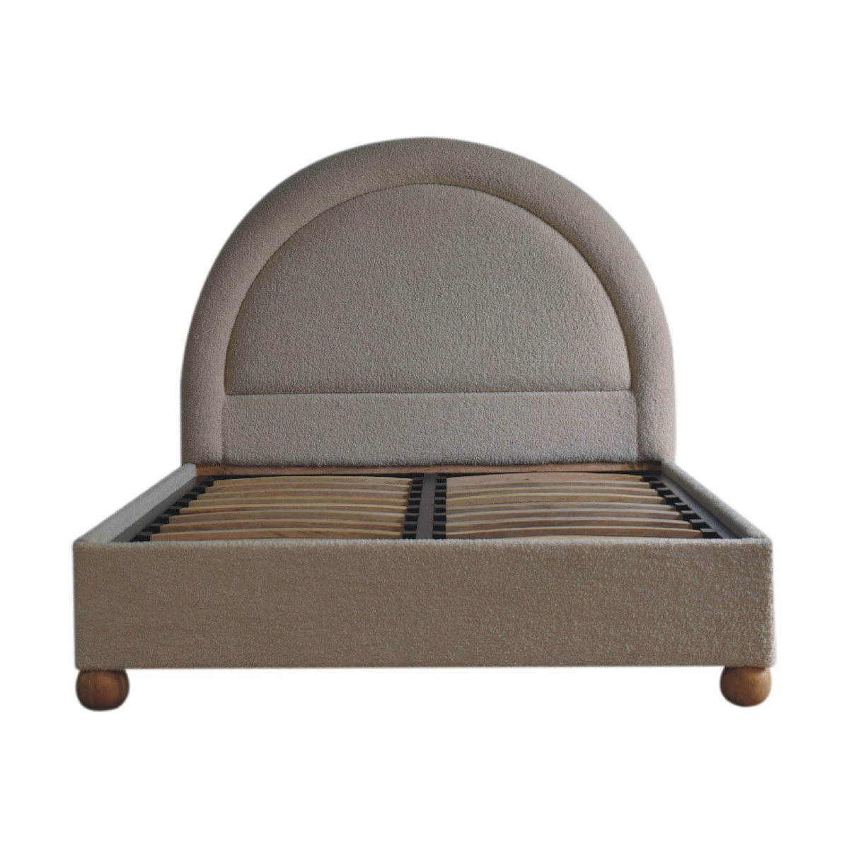 Cream boucle double bed with beige upholstered curved headboard and wooden legs perfect for cozy bedrooms