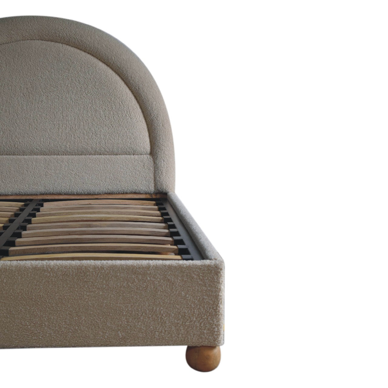 Cream boucle double bed with beige upholstered curved headboard and wooden slats for sturdy support