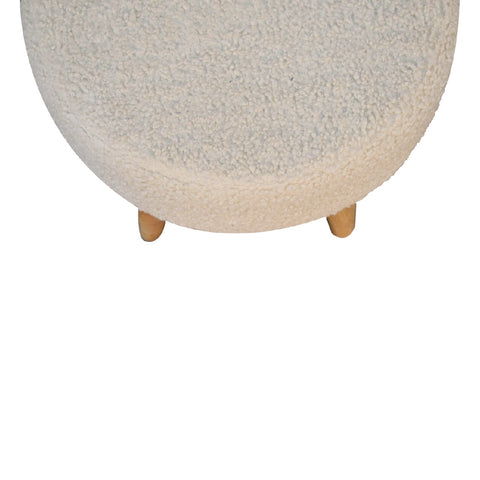 Cream boucle petite footstool with a plush textured surface and light wooden legs perfect for comfy seating
