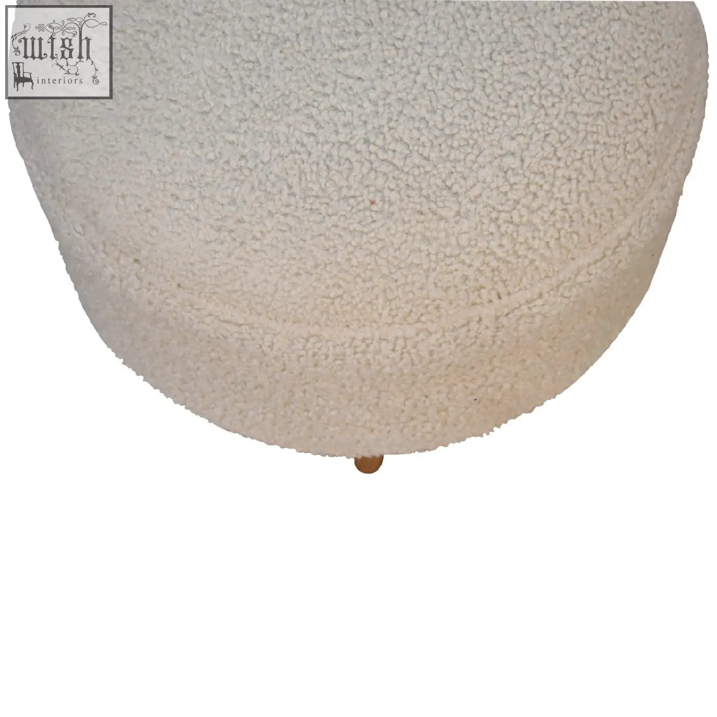 Cream boucle rounded footstool with cream-colored plush upholstery and a single solid mango wood leg at the base