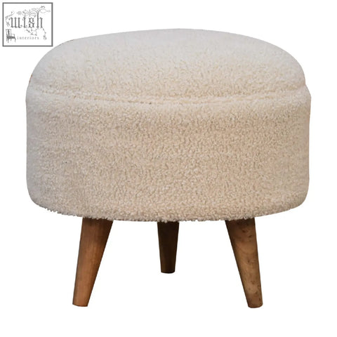 Cream boucle rounded footstool with cream sheepskin texture and mango wood legs perfect for cozy seating
