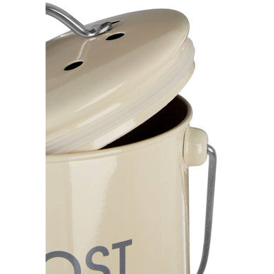 Cream compost bin made of enamel with matching lid metal handle and side loop for easy composting
