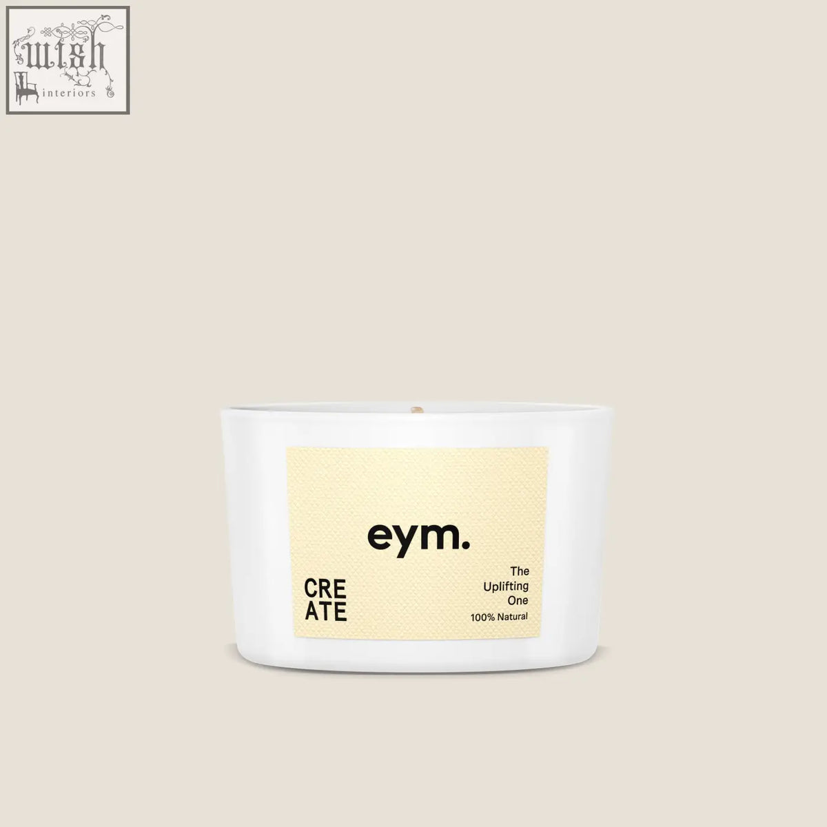 A white cylindrical mini candle in a minimalist container with a beige label from eym called the uplifting one