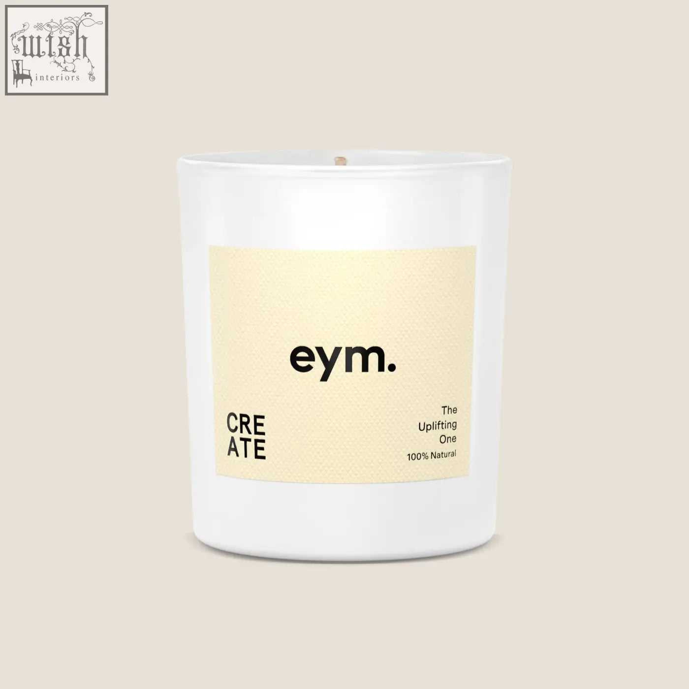 A minimalist white glass standard candle jar with a pale yellow label from eym designed for modern home decor