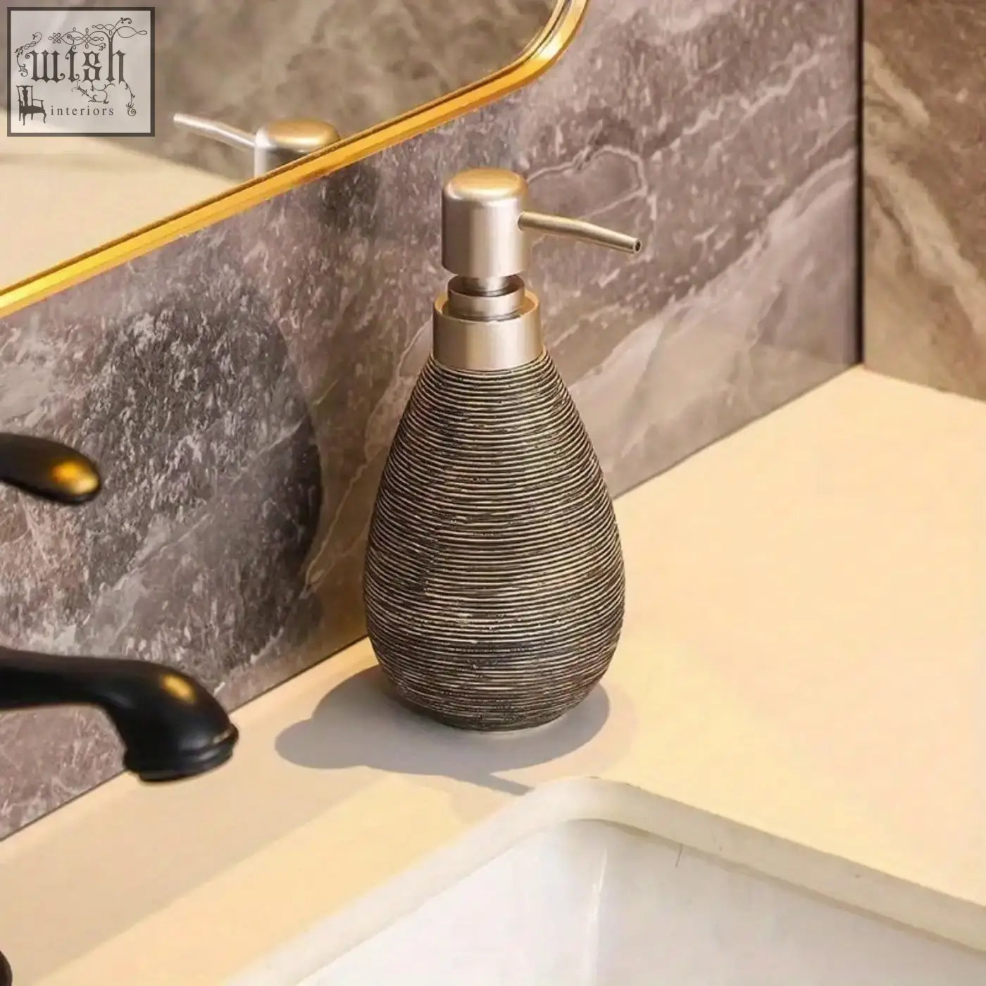 A sleek retro style ceramic soap dispenser with a textured metallic finish and brushed silver pump for hand soap use
