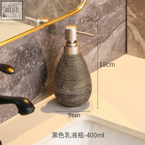 A sleek black retro style ceramic soap dispenser with ribbed texture and brushed pump for hand soap use