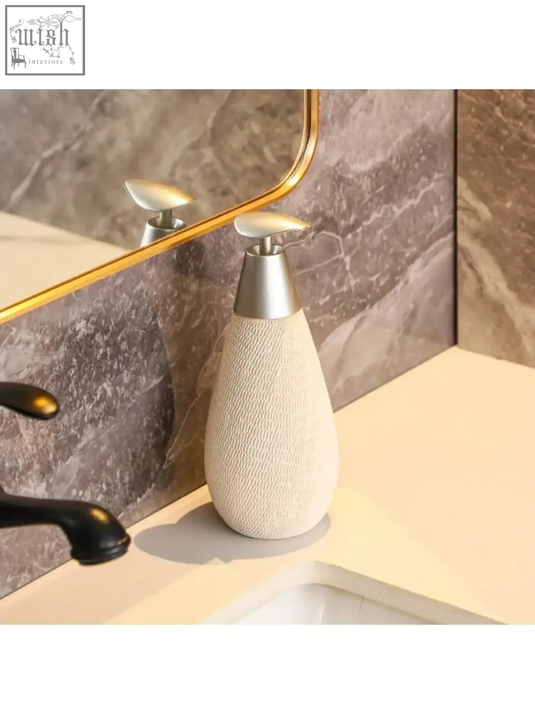Cream-colored retro style ceramic soap dispenser with textured body and silver pump for hand soap use in bathrooms and kitchens