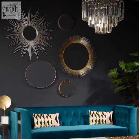 A collection of five wall mirrors with cristal silver finish and sunburst metallic frames in silver and gold tones